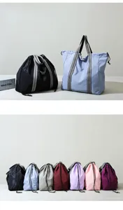 Detail view showing large capacity Oxford travel bag multi-color options and drawstring design.