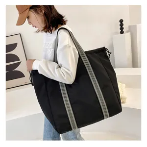 Large capacity oxford cloth travel tote bag with striped handles and drawstring closure.