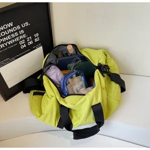 Waterproof travel duffel shoulder bag for fitness and sports, large capacity yellow gym bag.