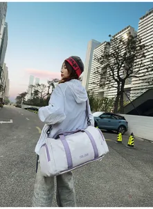 Large capacity sports duffel bag, stylish color block travel fitness bag with shoulder strap.