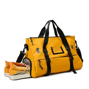 Large capacity fitness duffel bag with separate shoe compartment for travel and gym use.