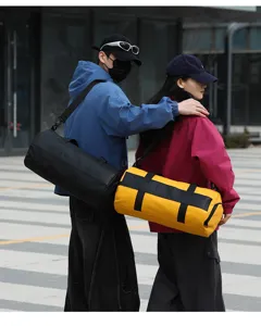 Outdoor fashion sports duffel bag detail view, showing large capacity with cylindrical design.