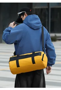 Detail shot of stylish yellow sports duffel bag, large capacity travel fitness gym bag.