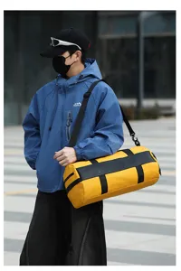 Large capacity yellow sports duffel bag for gym travel fitness and swimming activities.