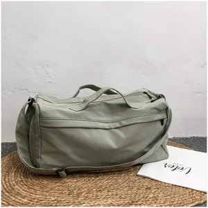 Ruime sport- en reistas in grijs-groene kleur voor fitness en yoga met schoenenvak.
