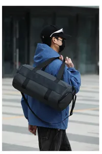 Detailed view of the dark grey large capacity fitness duffel bag for sports travel.