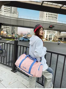Detailed view of the stylish color-block fitness duffel bag outdoors, showing large capacity.