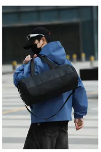 Black sports duffel bag for gym travel, large capacity waterproof training bag for men and women.