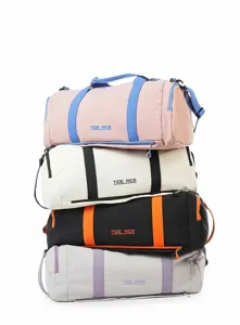 Detailed view of stackable colorful gym duffel bags featuring contrast color designs and handles.