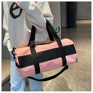 Pink cylindrical fitness duffle bag with black straps, large capacity travel sports gym bag.