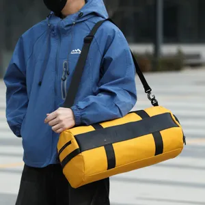Large capacity yellow sports duffel bag, waterproof fitness gym bag for men and women travel.