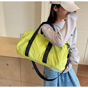 Casual neon yellow travel duffel bag with black straps for versatile daily sports.