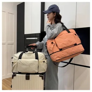 Grand sac de voyage pliable étanche multifonction sac à langer sac à main pratique.
