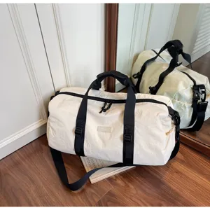 Casual travel duffel bag with adjustable shoulder strap, waterproof gym bag for sports.