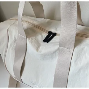 Lightweight beige travel duffel bag oxford cloth gym bag with sturdy straps for daily yoga workouts.