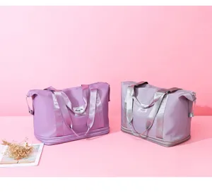 Detailed view of the purple expandable travel gym bag with dry wet separation and luggage sleeve.