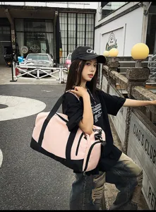 Large capacity pink and black sports gym duffel bag for travel, fitness and outdoor sports.