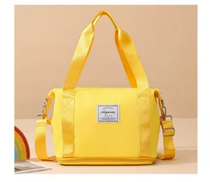 Yellow gym bag for women, expandable travel duffel with shoulder strap and dry wet separation.