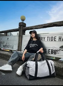 Large capacity fitness duffel bag for gym, travel, and sports with wet and dry separation.