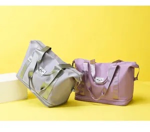 Two-layer expanding travel duffel bag, casual gym bag with luggage strap and wet dry compartment.