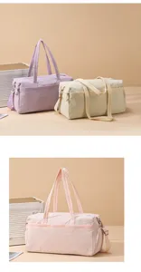 Detail view of large capacity travel duffel gym bag with comfortable handles and multi compartments.