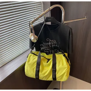 Waterproof gym duffel bag for travel and sports, large capacity yellow weekend bag.