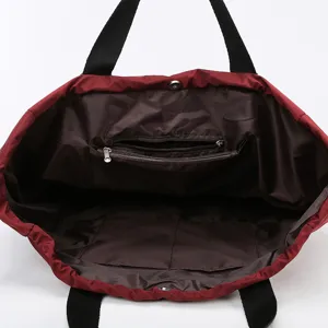 Large capacity oxford cloth travel tote bag with inner zipper pocket and sturdy black straps.