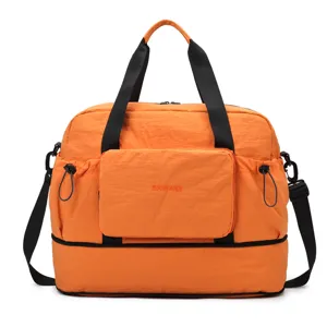 Grand sac de voyage pliable de grande capacité avec séparation sec humide et poignées.