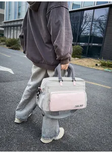 Large capacity travel duffel bag for women and men, stylish gym sports shoulder handbag.