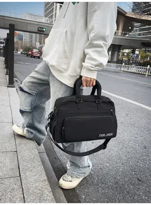 Large capacity black travel duffel bag for fitness and short trips with shoulder strap