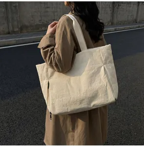 Casual canvas tote bag for women, large capacity shoulder bag with zipper pocket and wide strap.