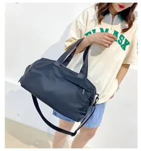 Black nylon gym duffel bag for women, waterproof sports travel bag with shoe compartment