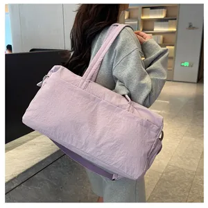 Lightweight purple gym duffel bag for women, large capacity travel tote with shoulder strap.