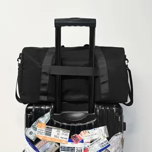 Large capacity travel duffel bag, waterproof sports gym bag with luggage strap for fitness.