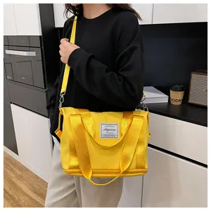 Small gym bag for women, expandable travel duffel with wet dry separation and shoulder strap.
