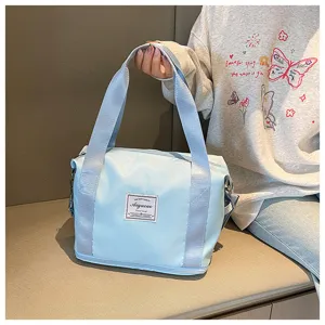 Small blue fitness gym bag with shoulder strap, durable travel duffel for women daily use.