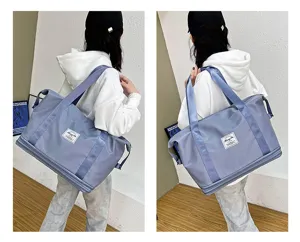 Large capacity travel gym bag with expansion layer and durable strap for daily fitness trips.