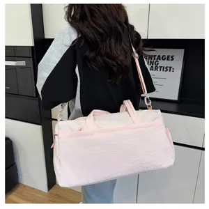 Pink travel duffel bag for women, large capacity sports gym bag with shoe compartment.