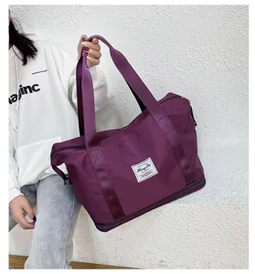 Two-layer expanding purple travel gym bag with durable fabric, large capacity and sturdy handles.