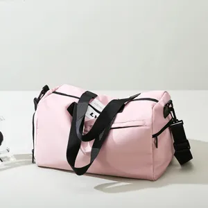 Pink gym duffel bag with wet dry compartment, stylish sports travel bag for women.