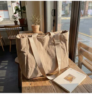 Casual beige padded tote bag, large capacity with wide strap and side zip pocket for daily use.