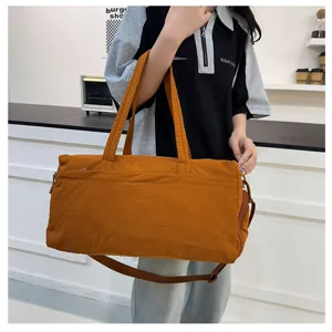 Large capacity fitness travel duffel bag for women, waterproof sport gym bag with shoe compartment.