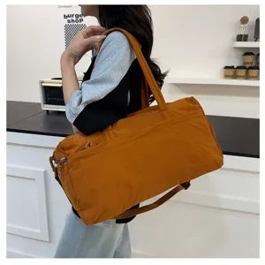 Large capacity brown sports duffel bag gym travel luggage bag for women daily outdoor use.