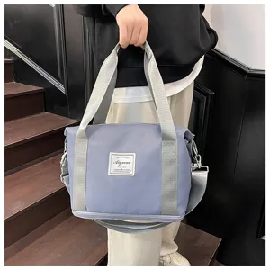 Small expandable fitness travel shoulder bag for women, waterproof crossbody sports gym bag.