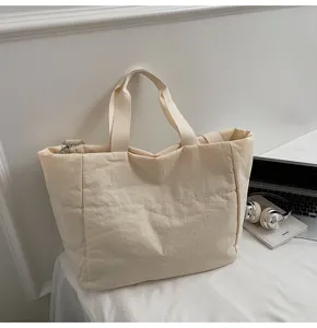 Detailed view of large capacity quilted tote bag, casual minimalist style handbag for daily use.