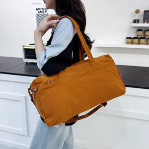 Large capacity sports gym bag for women, waterproof travel duffel bag with shoe compartment.