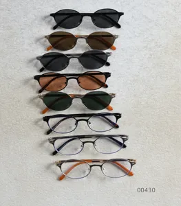 Vue détaillée de lunettes de soleil vintage à monture ovale en métal et de lunettes claires.