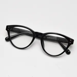 Close-up detail of black cat-eye TR90 optical glasses frame, vintage style clear lens eyewear.
