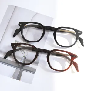 Vintage acetate optical eyeglass frames with titanium temples, stylish retro design detail.