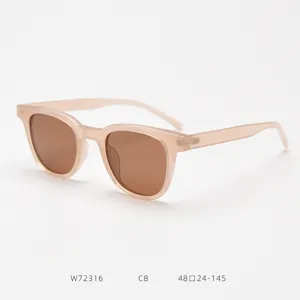Detail view of trendy polarized sunglasses with lightweight TR90 pink frame and brown lenses.